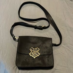 Harry Potter, black suede, mini bag with bronze Hogwarts emblem